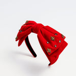 Kids red velvet bow headband with jeweled embellishments, product on white background