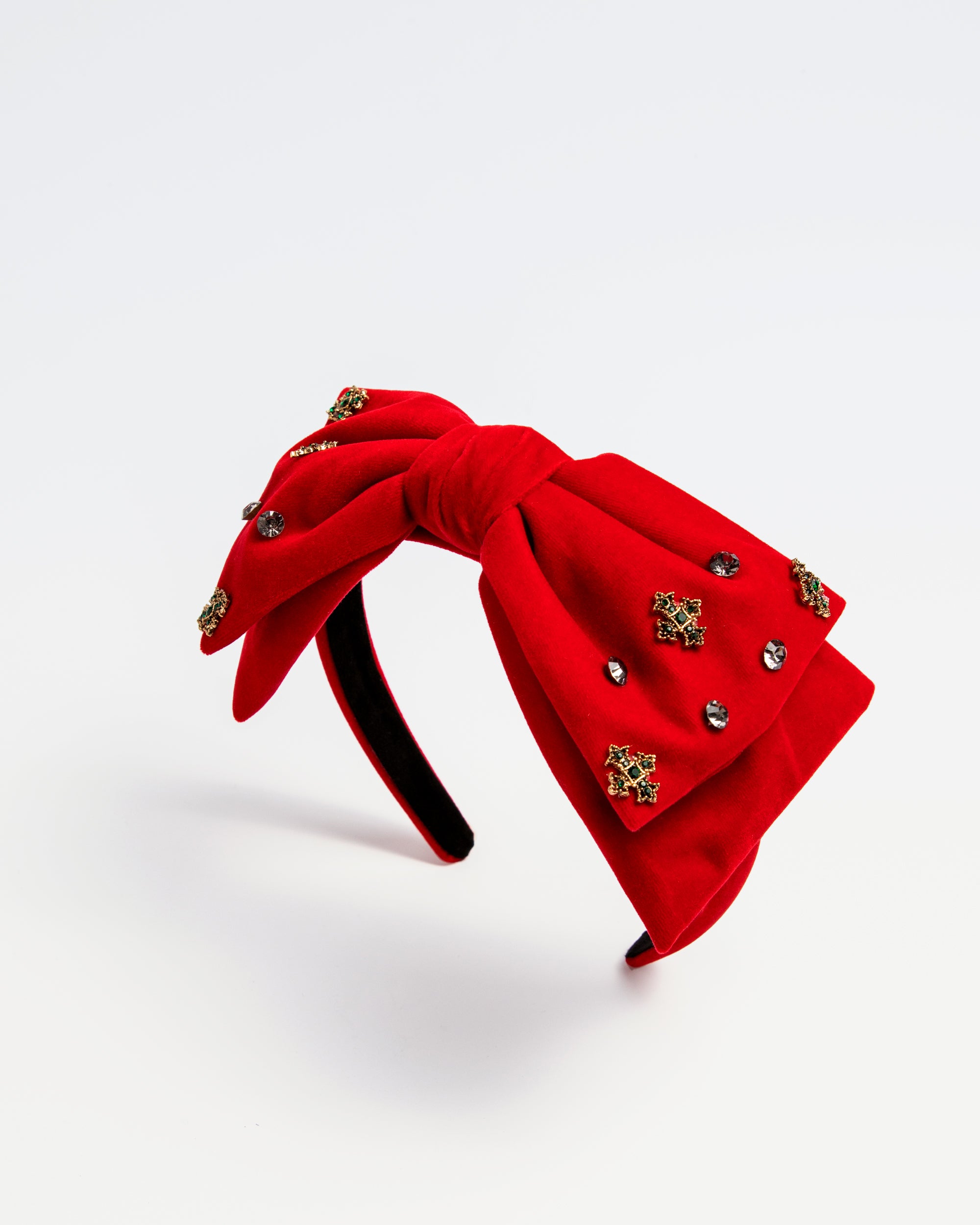 Kids red velvet bow headband with jeweled embellishments, product on white background