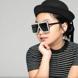 Child wearing Square Diamond Frame Sunglasses in black with a black hat and striped shirt