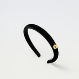 Black velvet kids headband with gold Maudysh logo charm on the side

