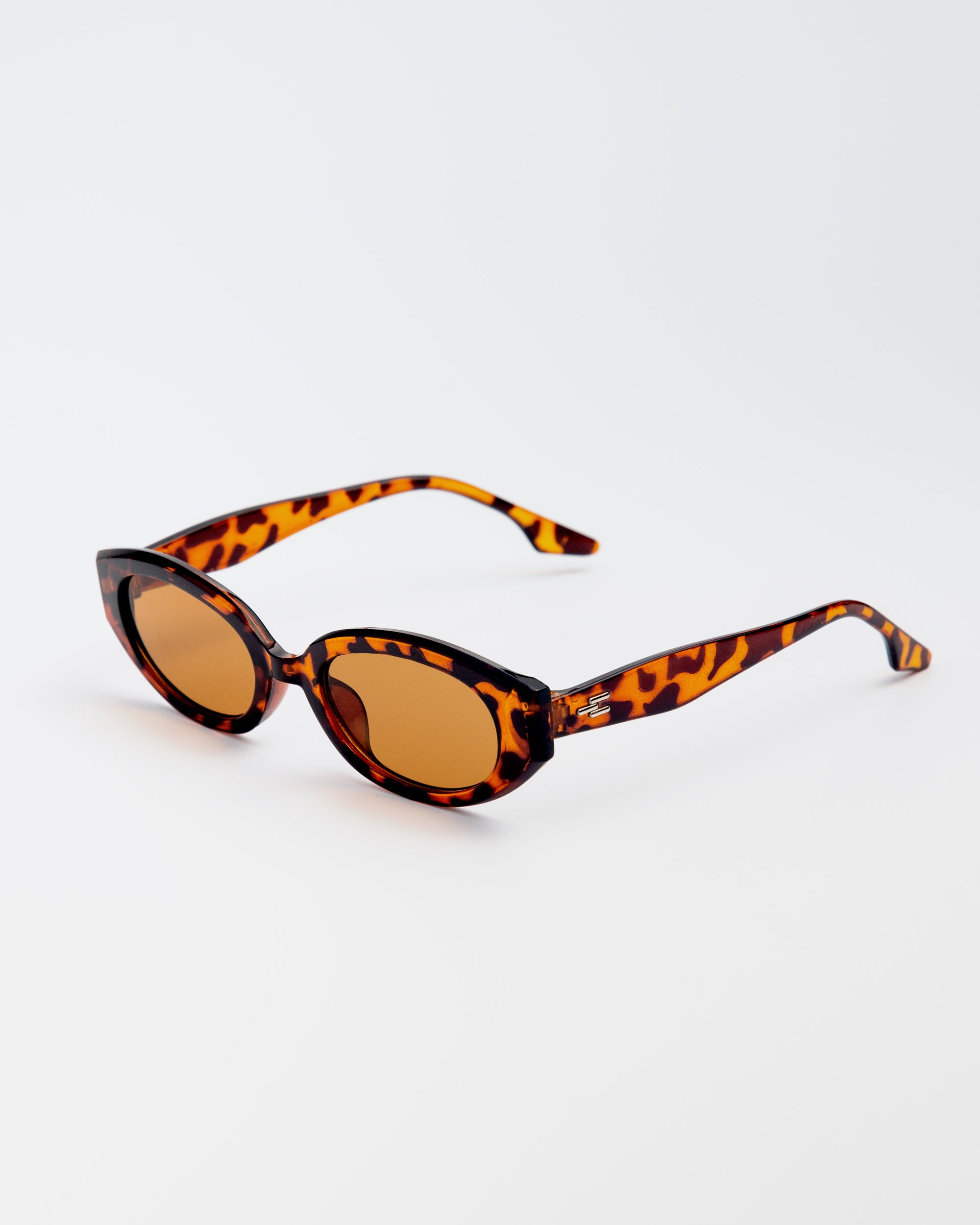 Vero Sunglasses in cheetah print with amber lenses and playful oval frames