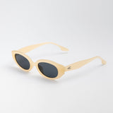 Vero Sunglasses in cream with dark lenses and curved oval shape for kids