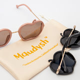 Gala Princess sunglasses in pink and black shown with Maudysh drawstring pouch on white background
