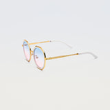 Side view of Goddess Cream sunglasses showing white temple tips and gold arms with engraved detailing