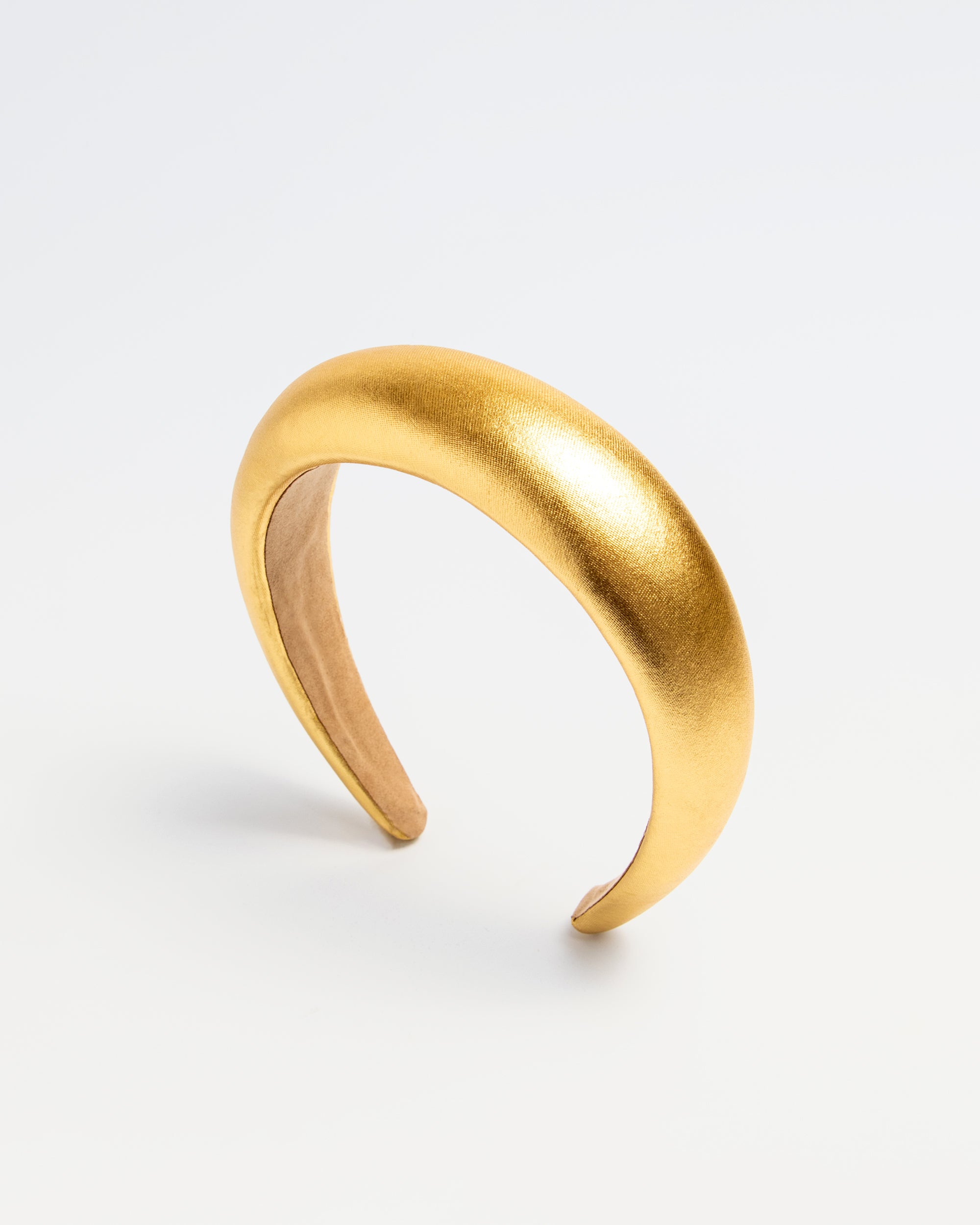 Shiny gold padded headband for kids with a smooth rounded silhouette