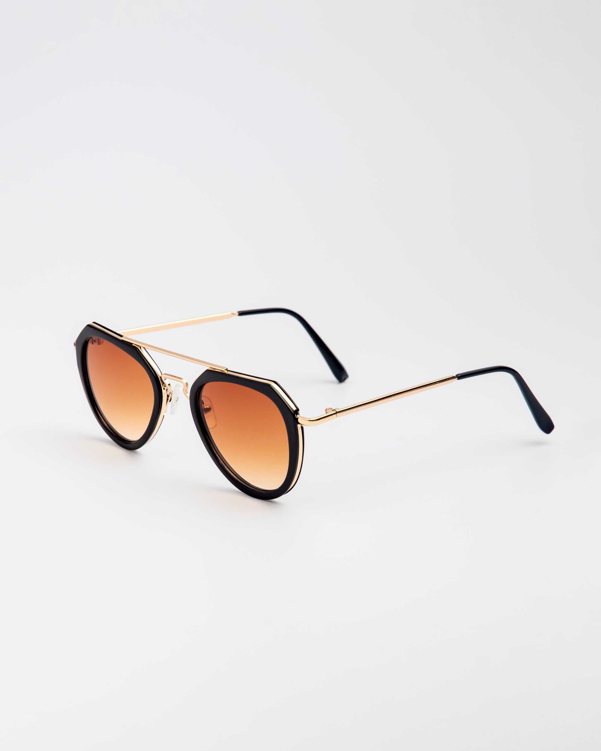 Jet Set sunglasses with black and gold aviator-style frames and warm brown tinted lenses on white background