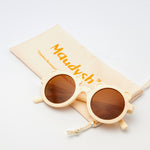  Little Miss Beary Glasses in cream with round lenses, displayed next to peach Maudysh drawstring pouch