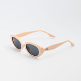 Vero Sunglasses in nude pink with bold oval frames and dark lenses