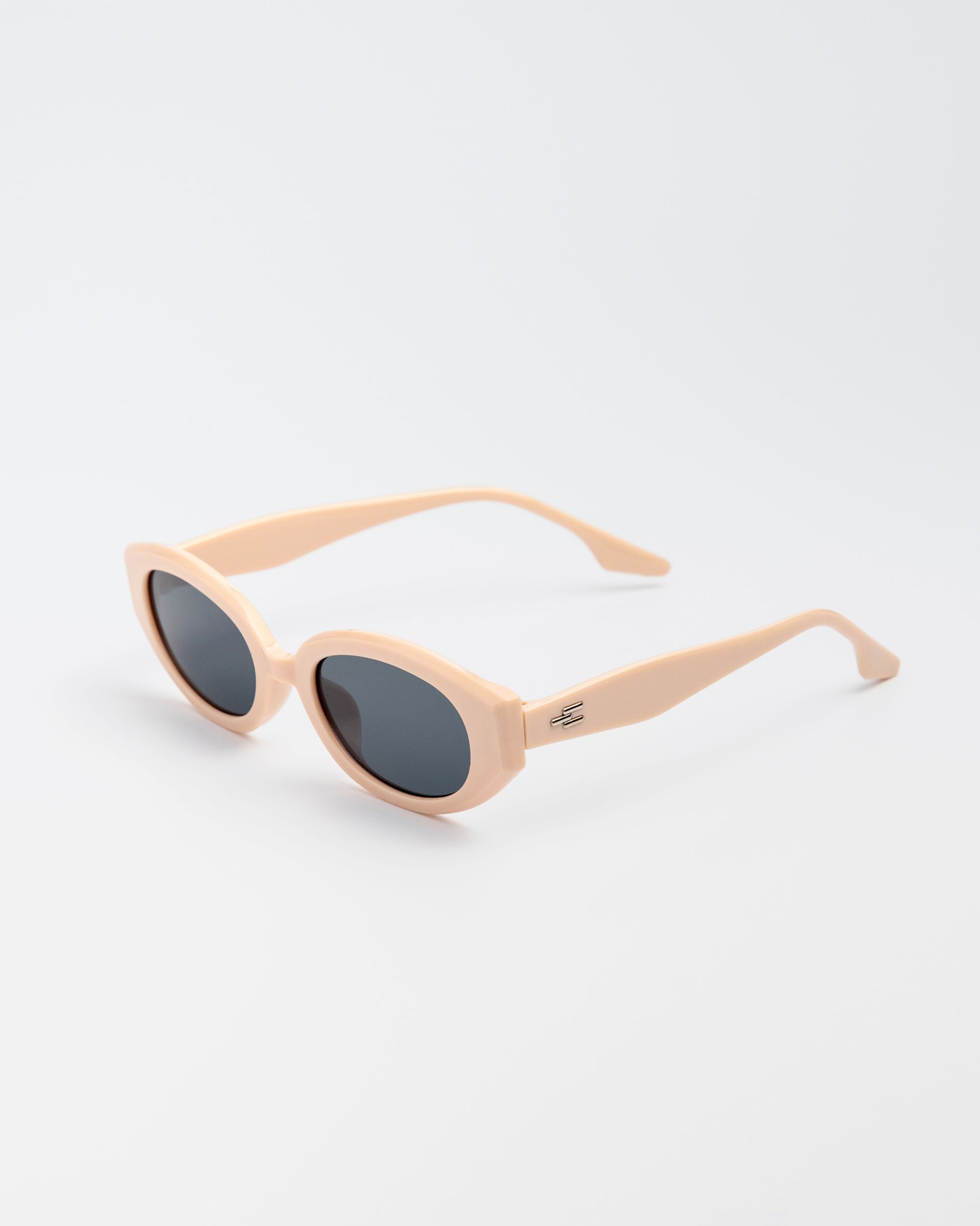 Vero Sunglasses in nude pink with bold oval frames and dark lenses