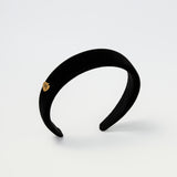 Padded black velvet headband for kids with a gold Maudysh logo charm on the side