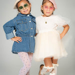 Two girls wearing Apple Delight sunglasses in pink and green with pearl berets and fashion outfits