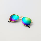 Rainbow Gleam sunglasses with gold aviator frames and mirrored rainbow lenses, shown flat on white background