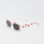 White sunglasses for kids with red heart print and black lenses