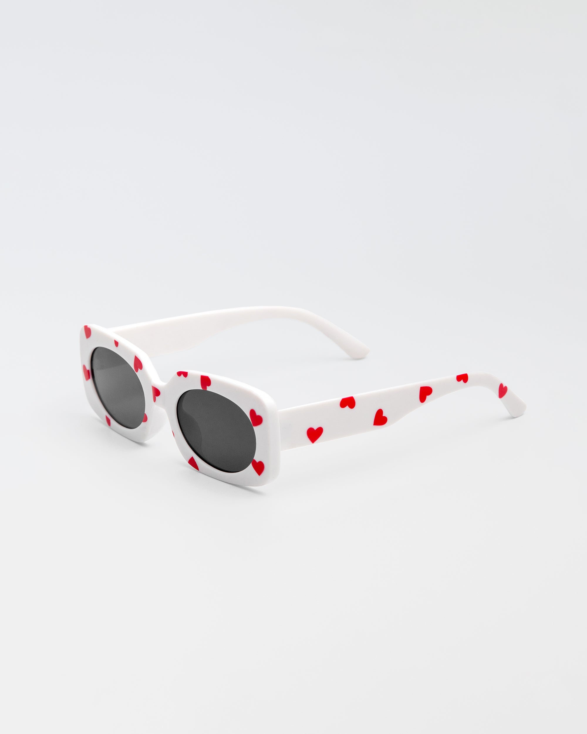 White sunglasses for kids with red heart print and black lenses