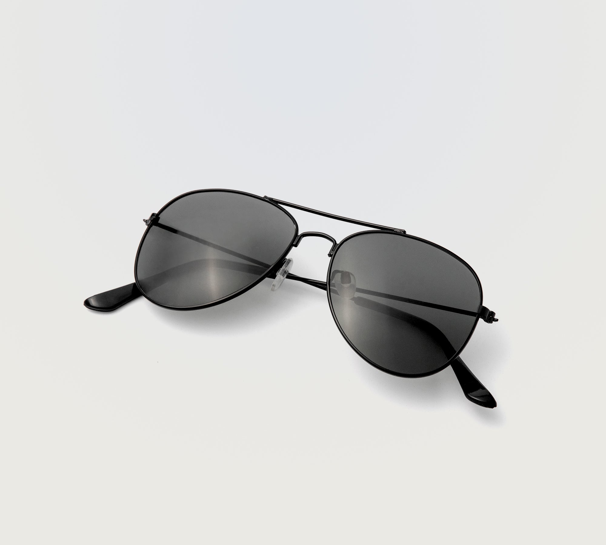 Rockstar Sunglasses in black aviator frame with dark tinted lenses displayed on white background