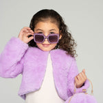 Girl wearing Sparkle Lilac Blooms sunglasses and holding a fluffy lilac bunny purse