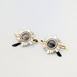 Front view of Starstruck Symmetry Sunglasses with jeweled circular frames and gold setting