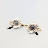Front view of Starstruck Symmetry Sunglasses with jeweled circular frames and gold setting