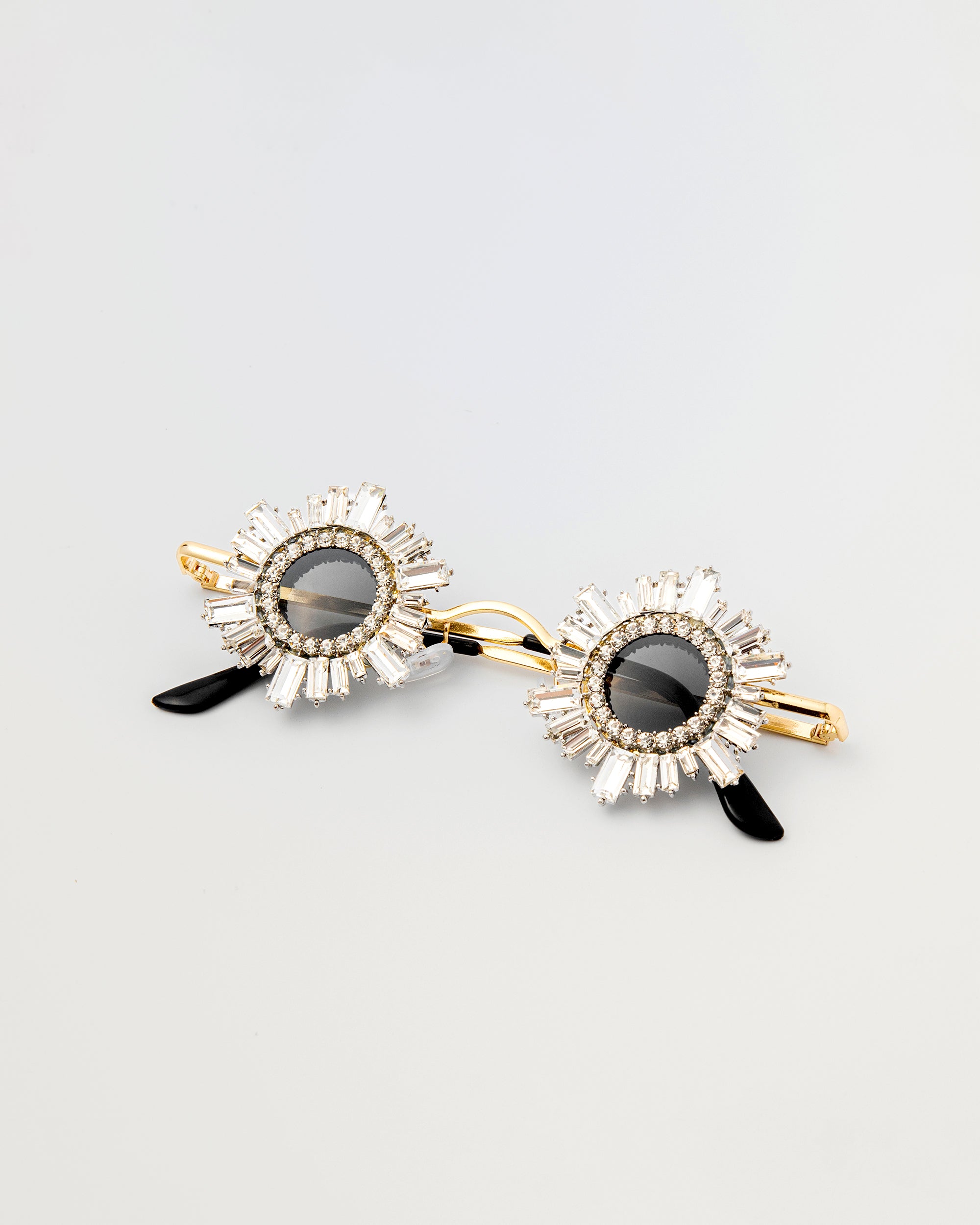 Front view of Starstruck Symmetry Sunglasses with jeweled circular frames and gold setting