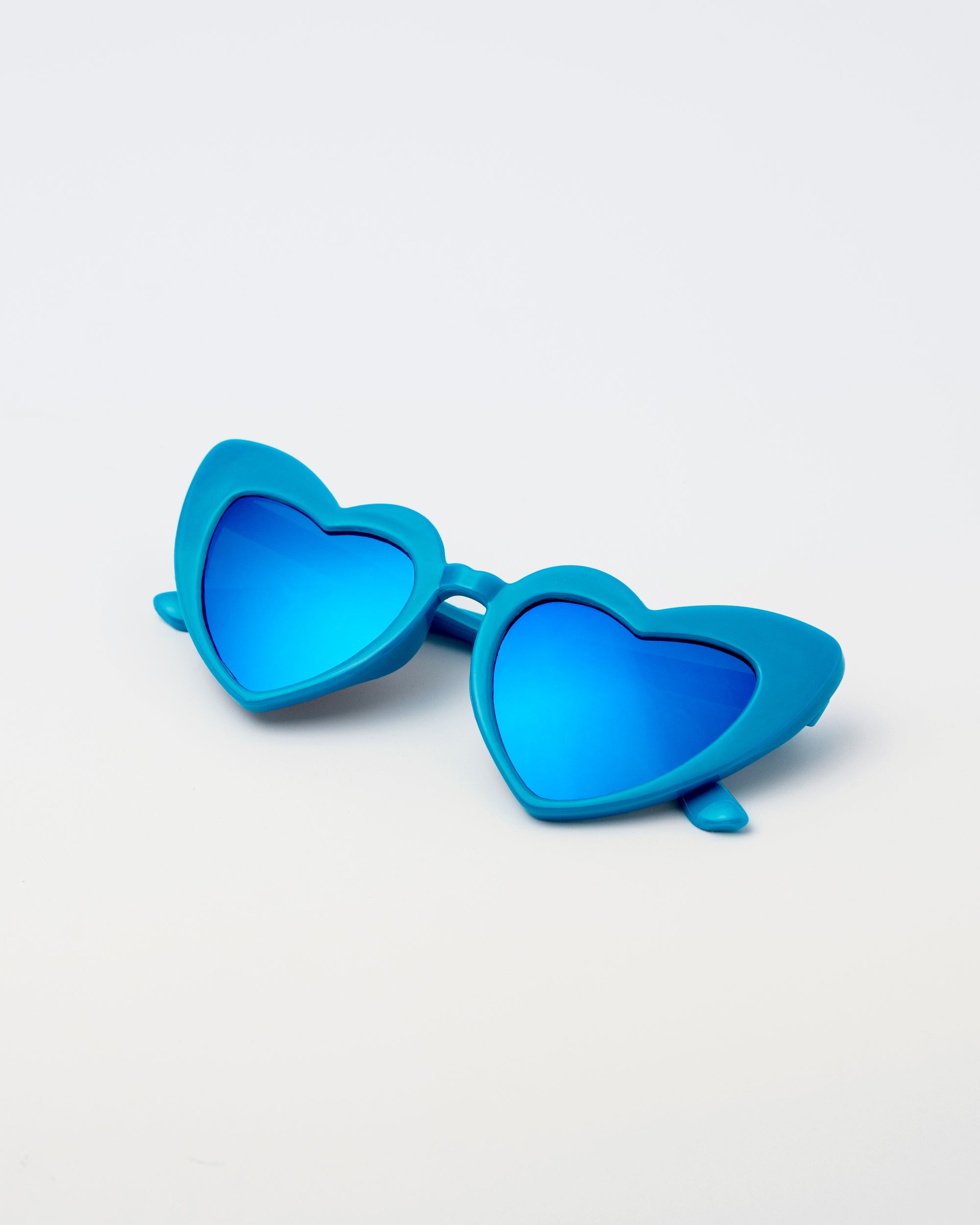 Blue kids heart-shaped sunglasses designed with a bold princess flair