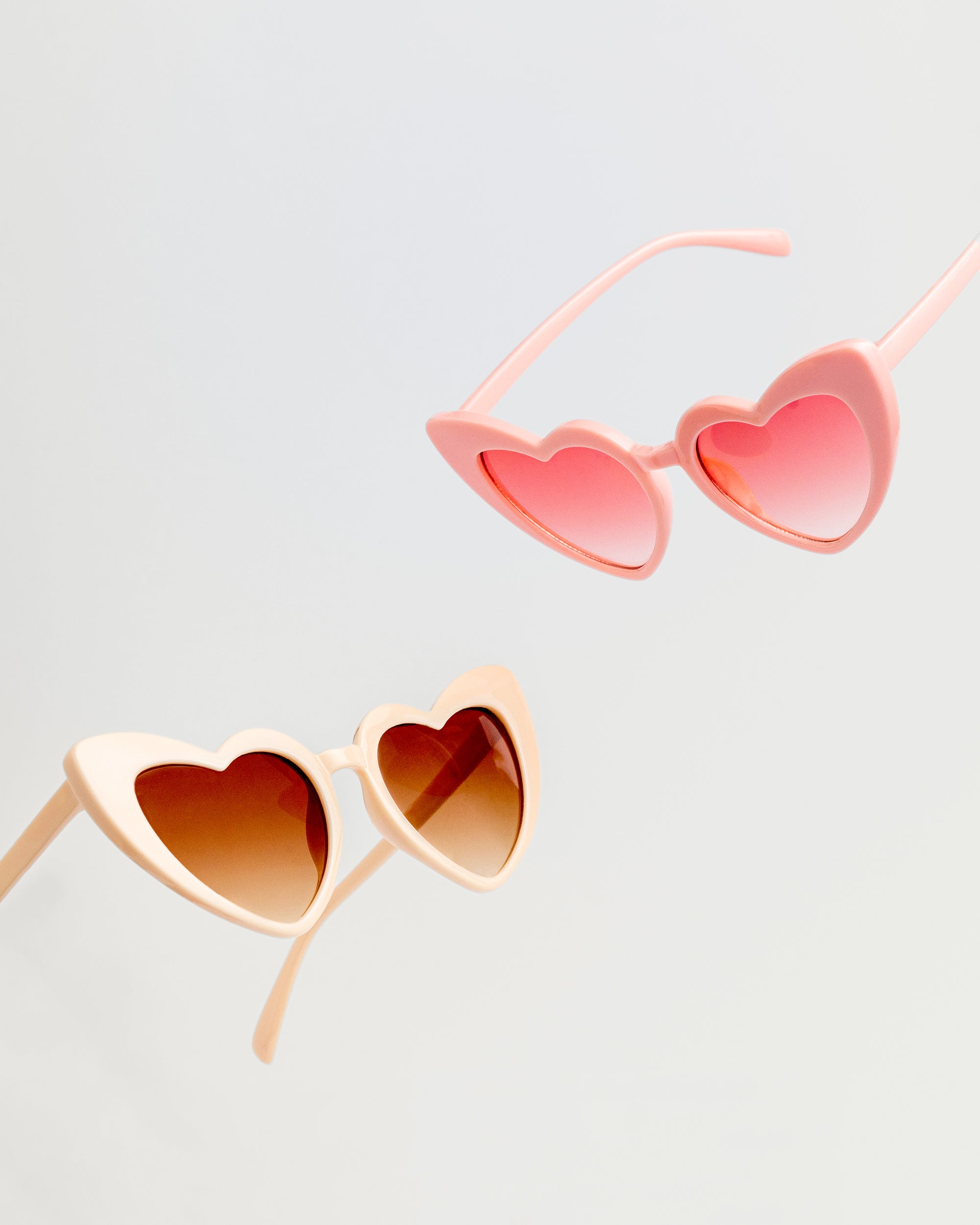 Group shot of colorful sweetheart princess sunglasses in the colors sugar cookie and pink for kids