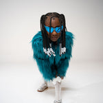 Side profile of child in blue striped shirt and heart sunglasses