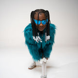 Side profile of child in blue striped shirt and heart sunglasses