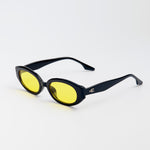 Vero Sunglasses in black with yellow lenses and thick oval frames for kids